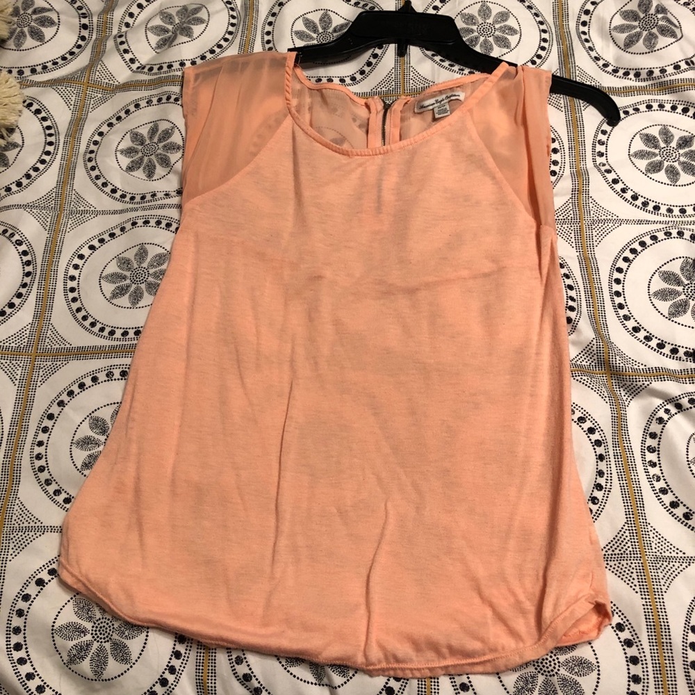 A sheer peachy top